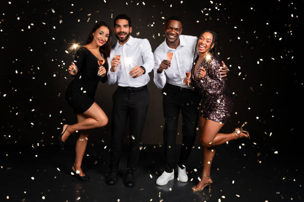 istock Happy multiethnic millennials friends celebrating New Year on black background 1789000996