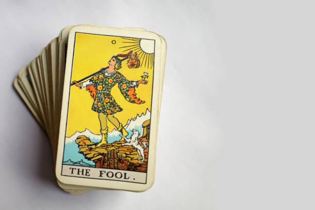 Old Tarot Deck with space Vintage Rider Waite tarot deck with the Fool on top. It is estimated that more than 100 million copies of this deck exist in more than 20 countries. the fool tarot card stock pictures, royalty-free photos & images