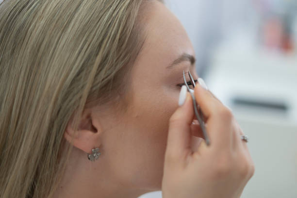 istock young girl doing makeup herself in the morning, daily routine 1789006035