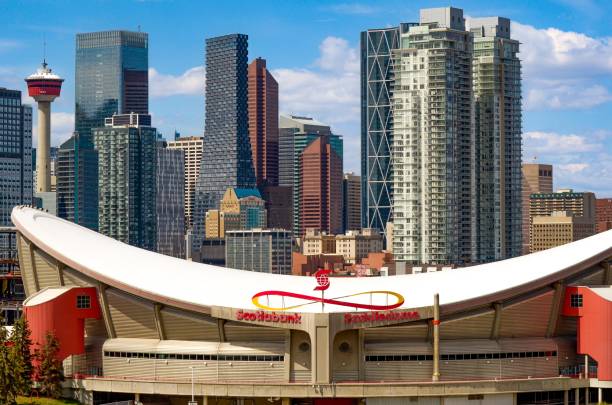 Calgary downtown Calgary, Alberta, Canada, May 22, 2022: Calgary's downtown with the Scotiabank Saddledome in the foreground. The dome is home to the Calgary Flames NHL club. scotiabank saddledome stock pictures, royalty-free photos & images