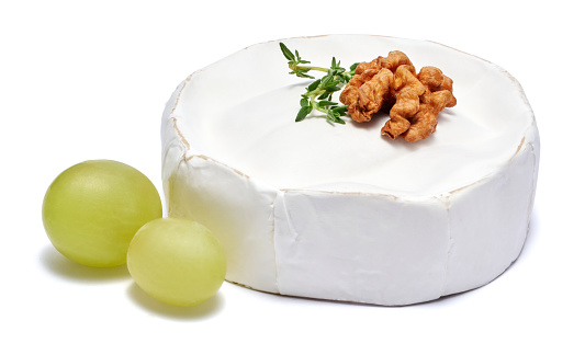 Fresh Brie or Camembert cheese Isolated on a white background.