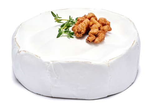 Fresh Brie or Camembert cheese Isolated on a white background.