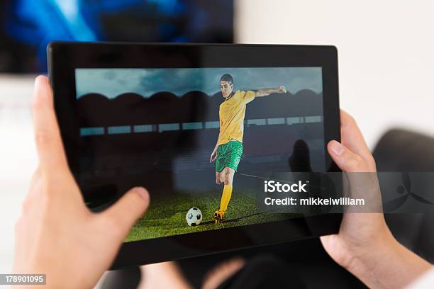 Digital Tablet Being Used To Watch A Football Match Stock Photo - Download Image Now