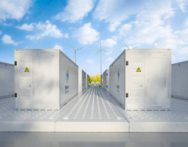 istock Energy storage systems or battery container units with turbine farm 1789051947