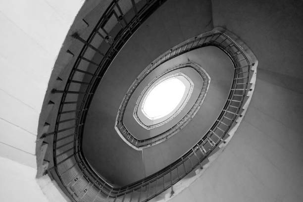Looking up at the steep spiral staircase in the building.