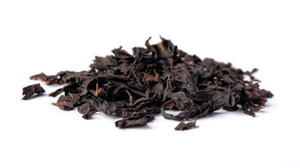 istock Heap of  black tea isolated on white background 1789079364