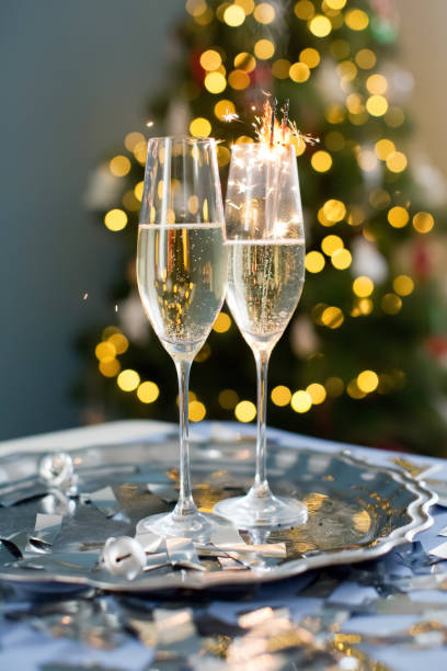istock Glasses with champagne near Christmas tree 1789102540