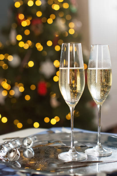 istock Glasses with champagne near Christmas tree 1789104161