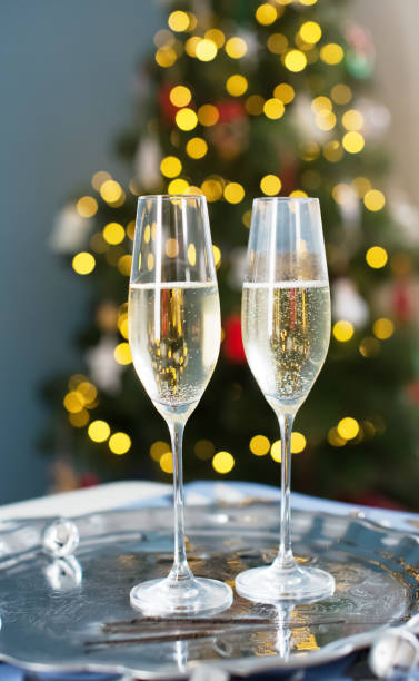 istock Glasses with champagne near Christmas tree 1789104162