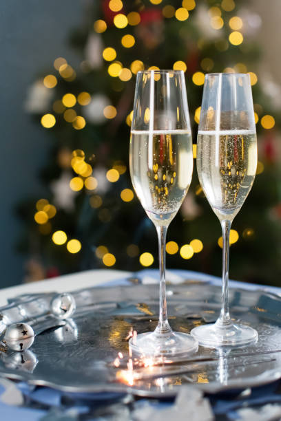 istock Glasses with champagne near Christmas tree 1789104682