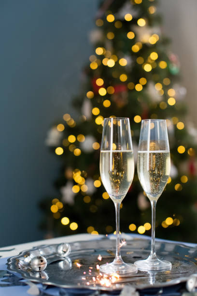 istock Glasses with champagne near Christmas tree 1789104698
