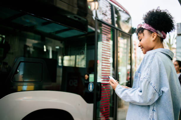 istock Happy young woman waiting for a bus 1789106835