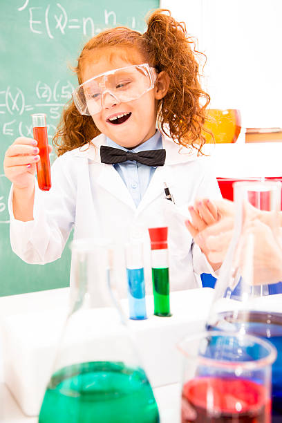 istock Education and Science:  Little red haired girl playing scientist. 178910811
