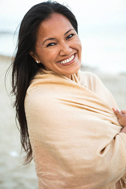 istock Happy woman smiling at the beach 178910816