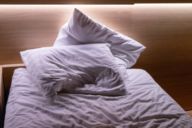 istock A sofa with two crumpled pillows and a crumpled blanket 1789124163