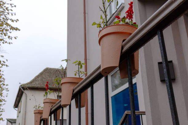 istock Plastic flower pots with cutouts are placed on the stair railing 1789125794