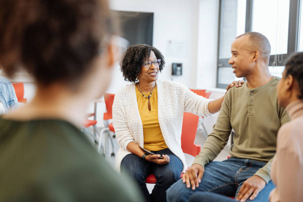 istock University students in campus. Students talking to female African professor during or after the lectures 1789126341