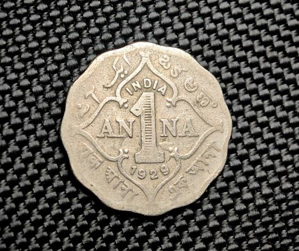 istock a small silver coin sitting on top of a table next to a window 1789126435