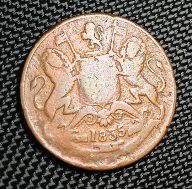 istock an old copper coin on a black cloth with writing and pictures 1789126882