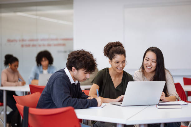 istock University students in classroom developing new scientific project. Students talking to female African professor during or after the lectures 1789127429