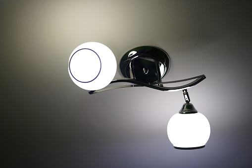 A lamp on the ceiling with two bulbs.