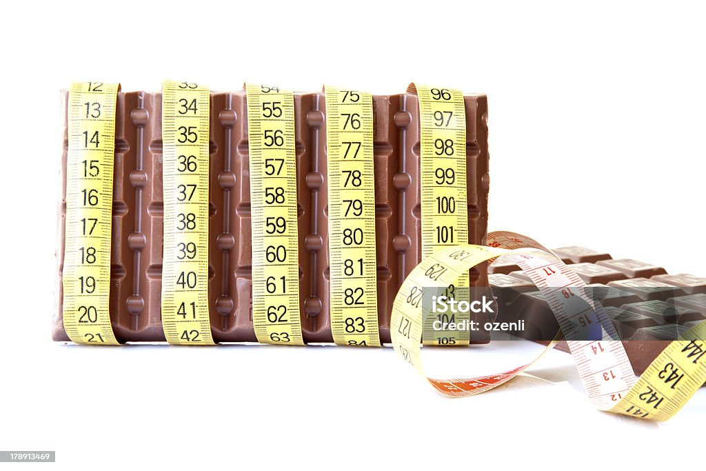 Chocolate y cinta métrica. - Foto de stock de Adicción libre de derechos
