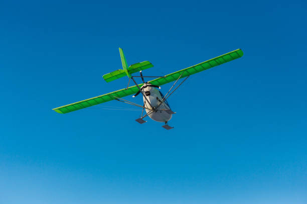 istock Small single-propeller plane flying over the blue sky. 1789140656