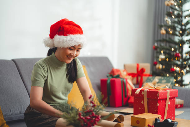 istock Asian woman wrapping presents for Christmas. 1789141185