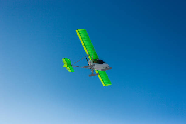 istock Small single-propeller plane flying over the blue sky. 1789141196