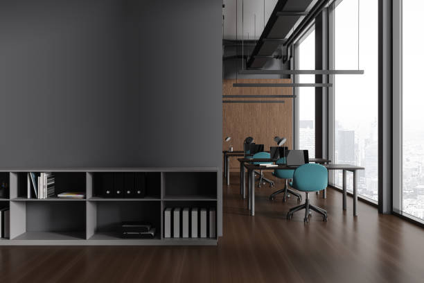 istock Grey coworking interior with desk and chairs, shelf and window. Mock up wall 1789154798