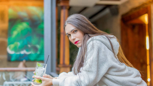 istock transgender woman having drink at bar 1789155345