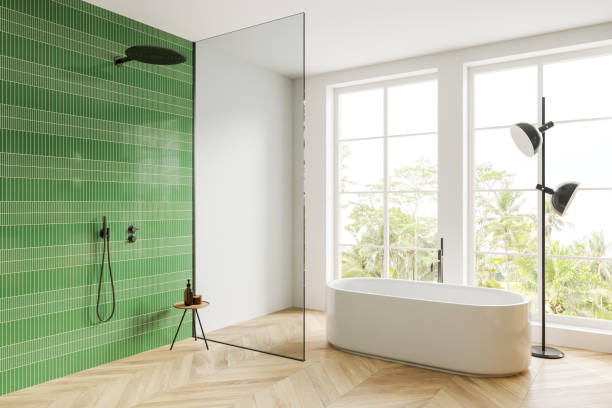 istock White and green tiled bathroom corner with tub and shower 1789170488