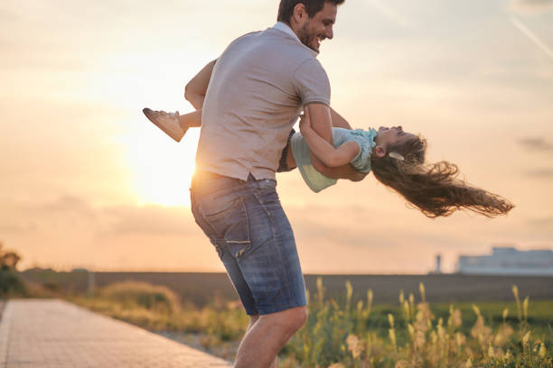 istock Father and daughter enjoying nature 1789175240