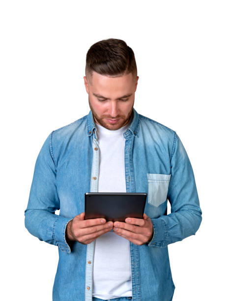 istock Young man with tablet in hands, isolated over white background 1789177911