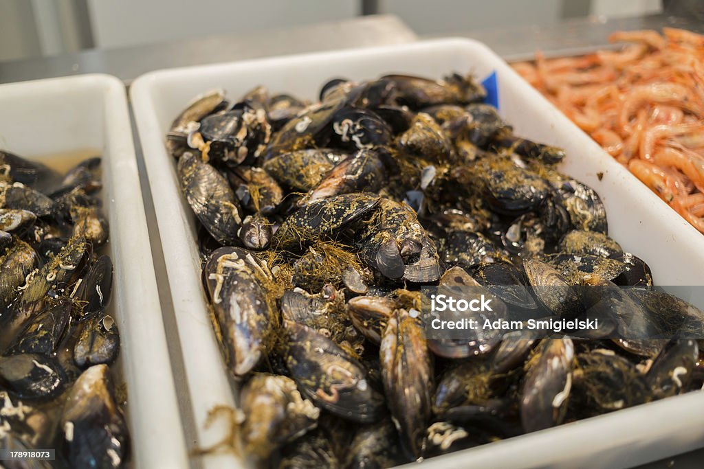 fish market fresh seafood laid out at a Spanish market Fish Vendor Stock Photo