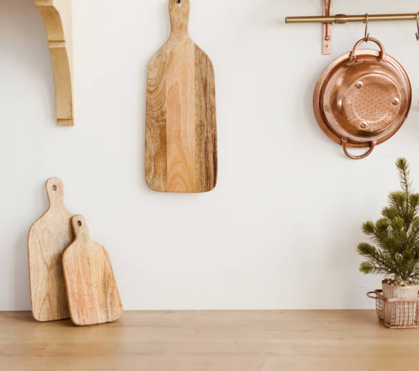 istock Wooden cutting board near white wall 1789182704