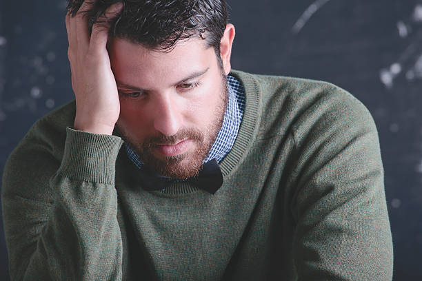 istock Stressed teacher man wearing stylish clothes in front a blackboard. 178918503