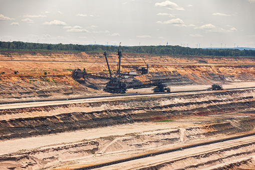 Aerial drone view of an open pit coal mine.