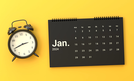 Alarm Clock And 2024 January Calendar On Yellow Background. Planning concept.