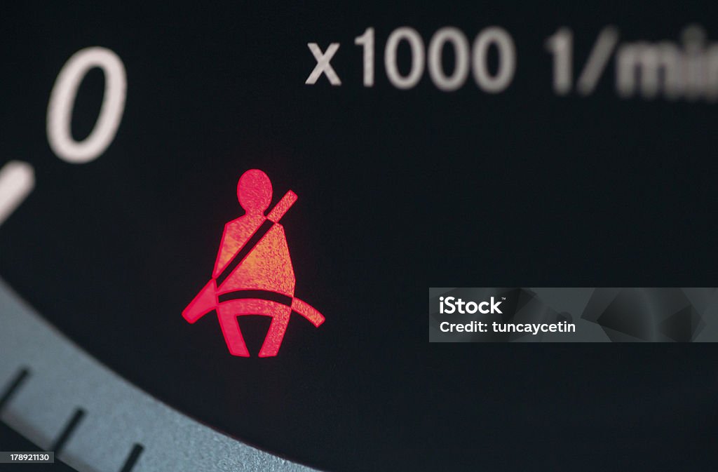 Red car light indicating unfastened seatbelt Seatbelt Sign. Seat Belt Stock Photo