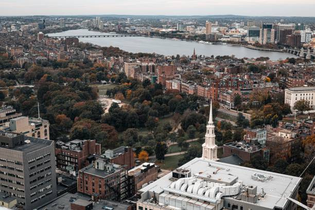 istock a large river sits below some buildings and a steeple 1789211930