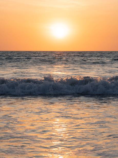 istock waves roll in on the shore during a beautiful sunset over the ocean 1789228253
