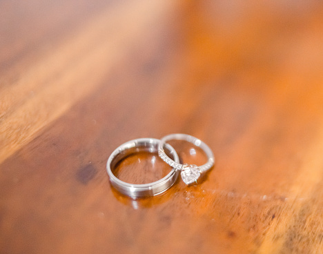 couple rings on wooden table