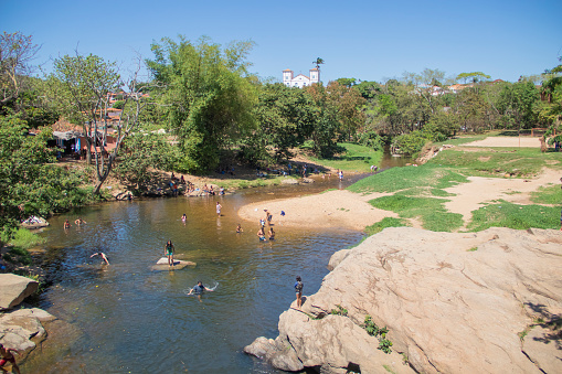 Brazilian people have fun at beautiful river on September, 2023, Pirenopolis, Brazil.