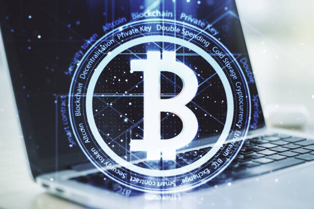 istock Double exposure of creative Bitcoin symbol with modern laptop on background. Cryptocurrency concept 1789306207