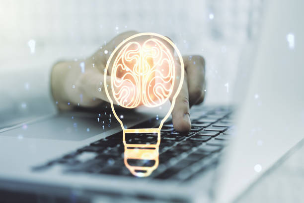 istock Creative idea concept with light bulb and human brain illustration and with hands typing on laptop on background. Neural networks and machine learning concept. Multiexposure 1789306747