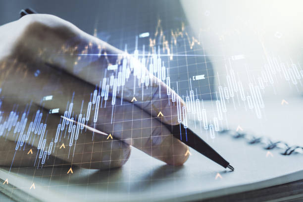 Double exposure of abstract creative financial diagram with world map and with man hand writing in notepad on background, banking and accounting concept Double exposure of abstract creative financial diagram with world map and with man hand writing in notepad on background, banking and accounting concept trader wall street stock market analyzing stock pictures, royalty-free photos & images