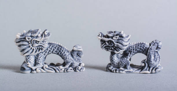 istock Two ceramic dragons on a gray background for Chinese New Year web banner 1789308424