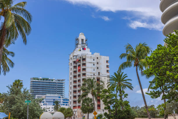 istock View of tall building partially covered in construction nets, undergoing reconstruction, on Collins Avenue in Miami Beach, USA. 1789323826