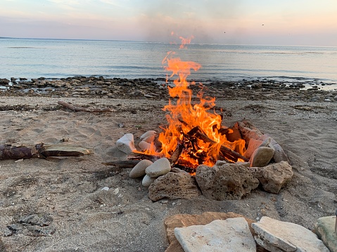 Bonfire by the seaside. Romantic scene